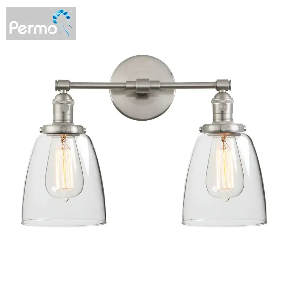 Permo vintage wall sconce with two brushed nickel fixtures and clear glass shades housing exposed filament bulbs