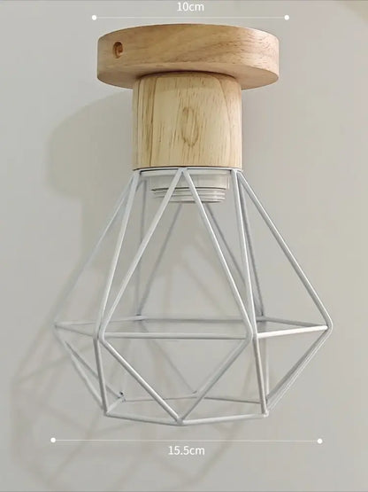 Minimalist pendant light with natural wood base and white iron cage perfect for dining room under 30 square meters