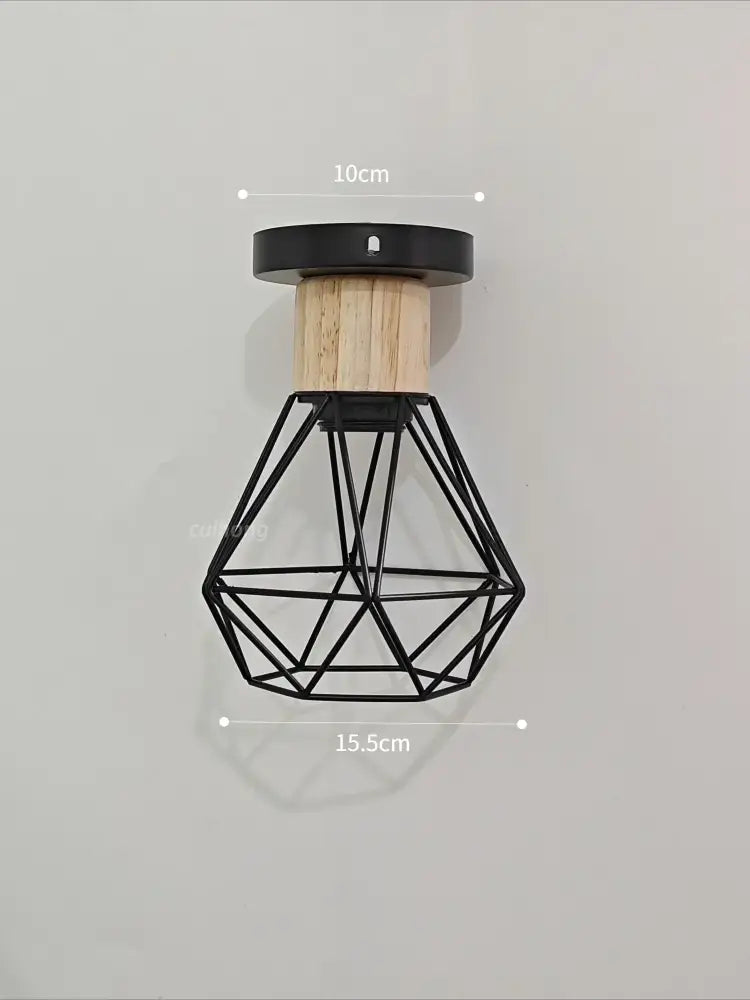 Vintage black wood and iron cage pendant light with geometric wire design and natural wood accent for dining rooms