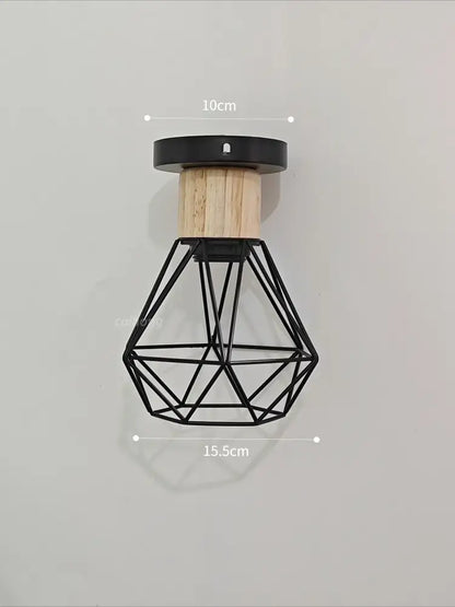 Vintage black wood and iron cage pendant light with geometric wire design and natural wood accent for dining rooms