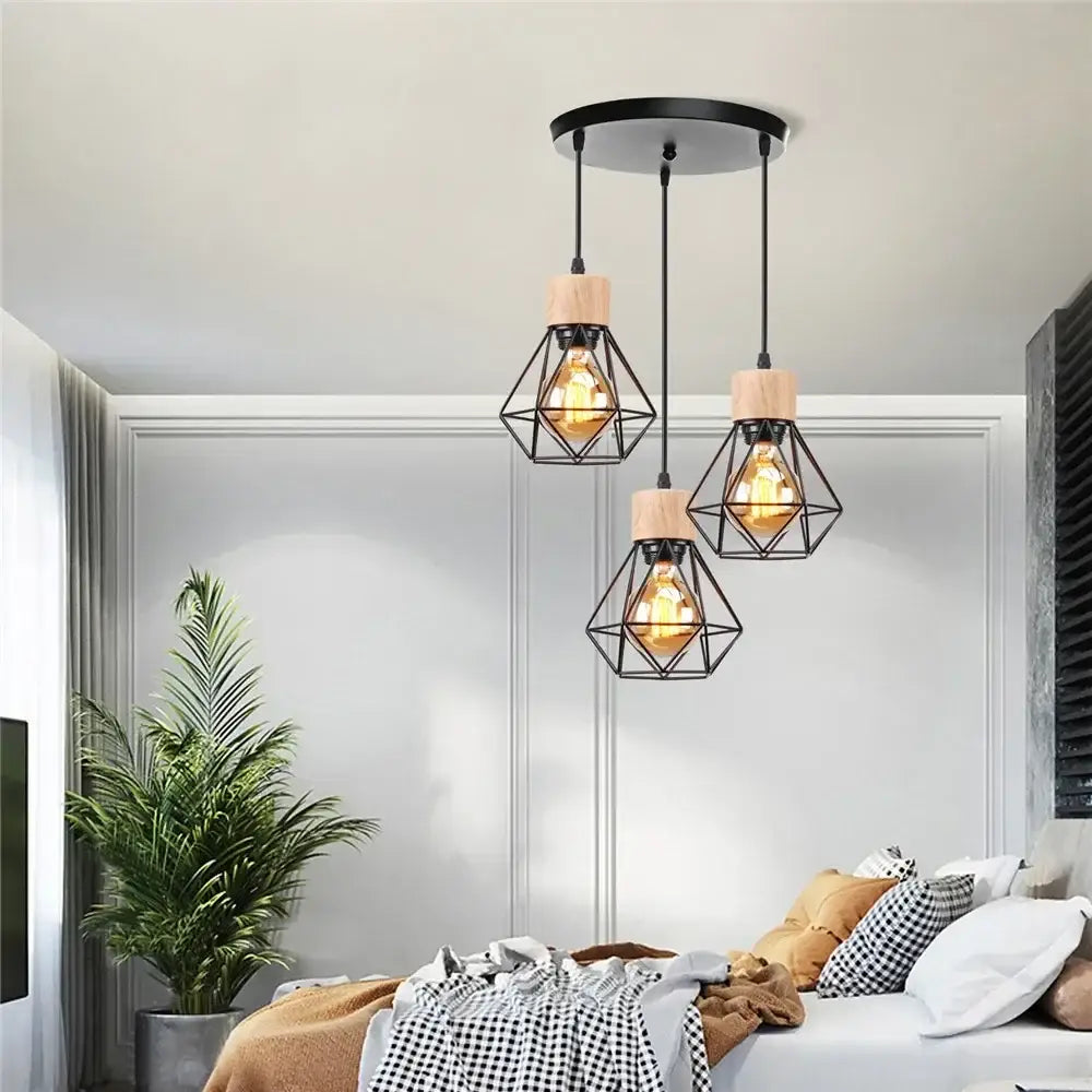 Vintage black wood and iron cage pendant light with geometric design and exposed filament bulbs for dining room use