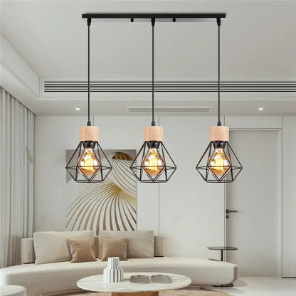 Three black vintage pendant lights with wooden caps and iron cage design hang from ceiling bar for dining room use