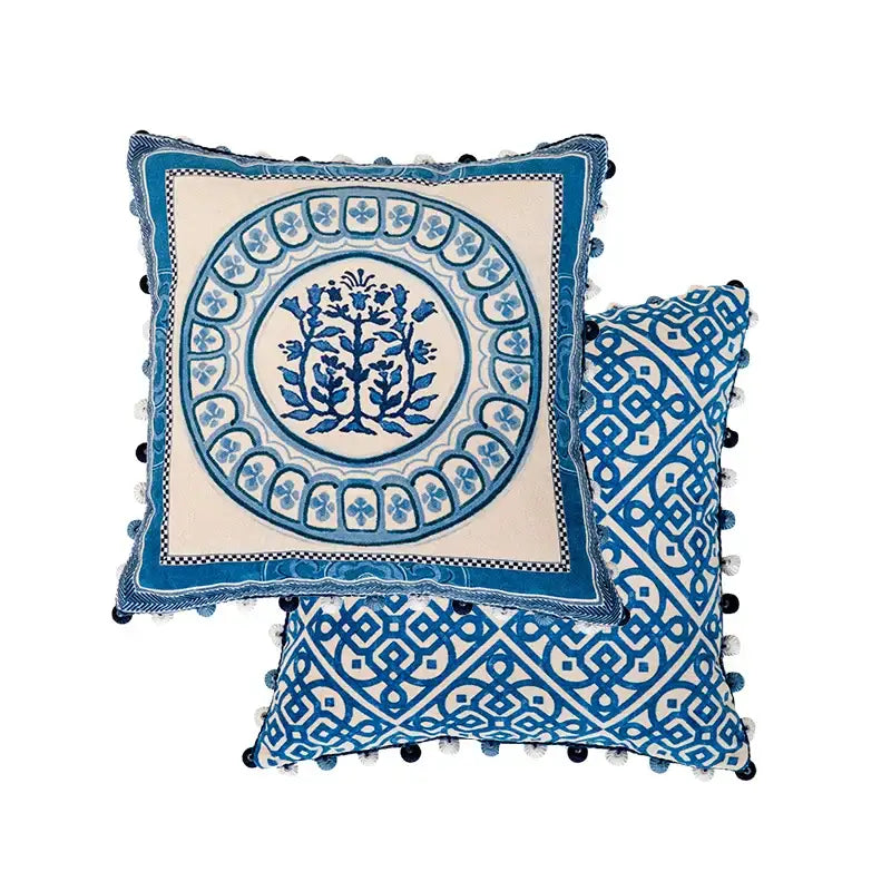 Vintage blue and cream peacock toile pillow cover with intricate floral and geometric embroidery and pom-pom edges cushion case