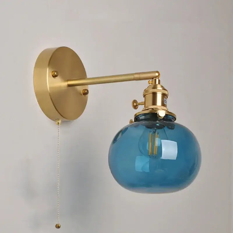Vintage blue glass wall lamp with brass hardware and pull chain switch ideal for bedroom decorbites blue glass sconce