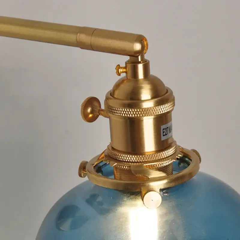 Brass-finished wall lamp with blue glass globe base vintage decorbites blue glass bedroom pull chain sconce