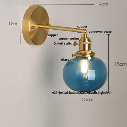 Vintage blue glass wall lamp with brass-finished copper sconce and spherical blue glass shade for bedroom decorbites blue glass