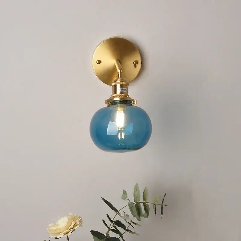 Vintage blue glass wall lamp with brass-finished mounting plate and decorbites blue glass for bedroom pull chain sconce
