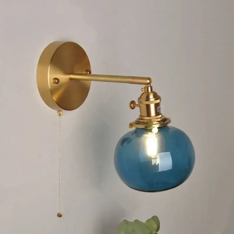 Vintage blue glass wall lamp with brass hardware and pull chain switch by decorbites blue glass for bedroom use