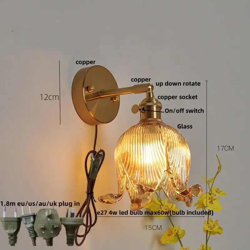 Gold-toned copper wall lamp with ribbed amber glass shade resembling an open flower for decorbites blue glass decor