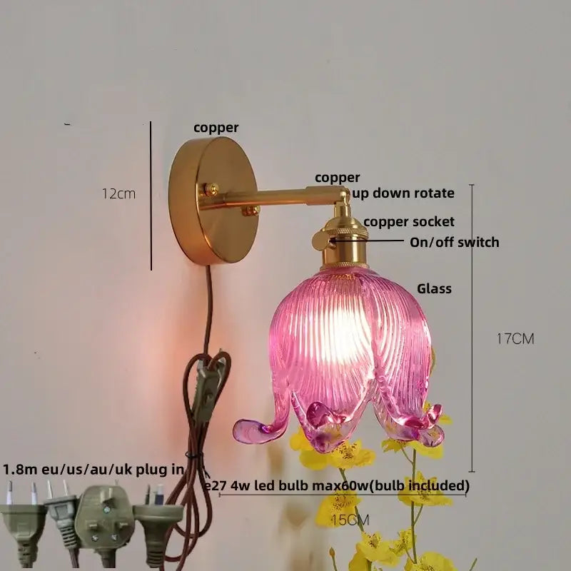 Pink ribbed glass flower wall sconce with copper hardware complementing vintage blue glass wall lamp decorbites blue glass
