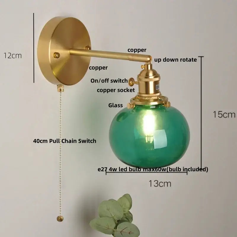 Vintage wall lamp with a brass copper arm and spherical blue glass globe featuring an led bulb for bedroom decorbites blue glass