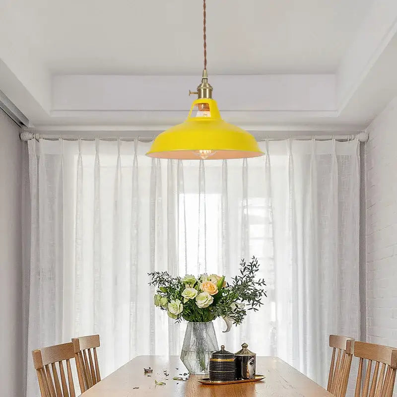 Vintage blue iron art pendant light with bright yellow industrial pendant light and brass-finished braided cord fixture