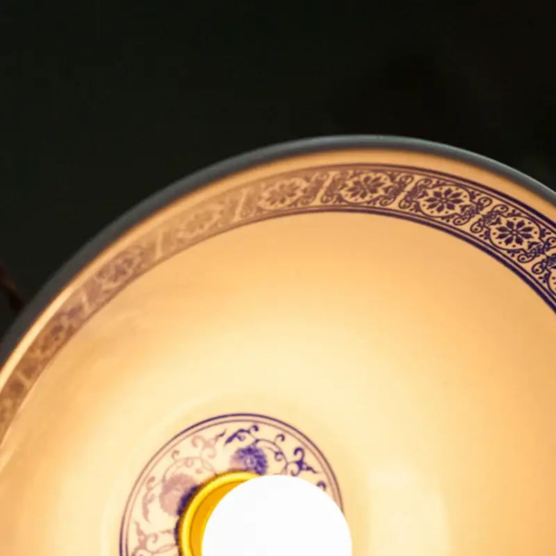 A warm-toned vintage blue and white ceramic pendant lamp with intricate floral led decorbites ceramic led design