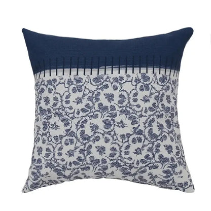 Square pillow cover with navy blue top and white bottom featuring dark blue floral pattern vintage decorbites blue tassel