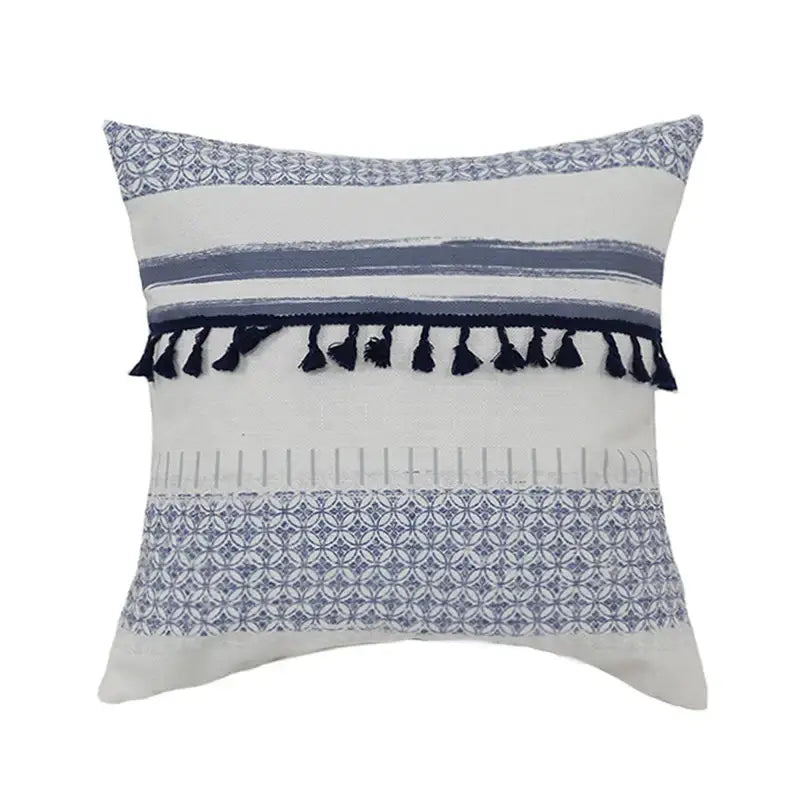 A vintage blue and white tassel pillow cover with horizontal blue stripes and black tassels for living room decorbites decor