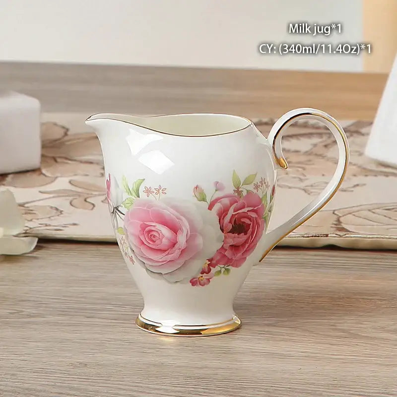 Vintage bone china milk jug with delicate white porcelain, hand-painted pink roses, green leaves, and gold trim decorbites bone china