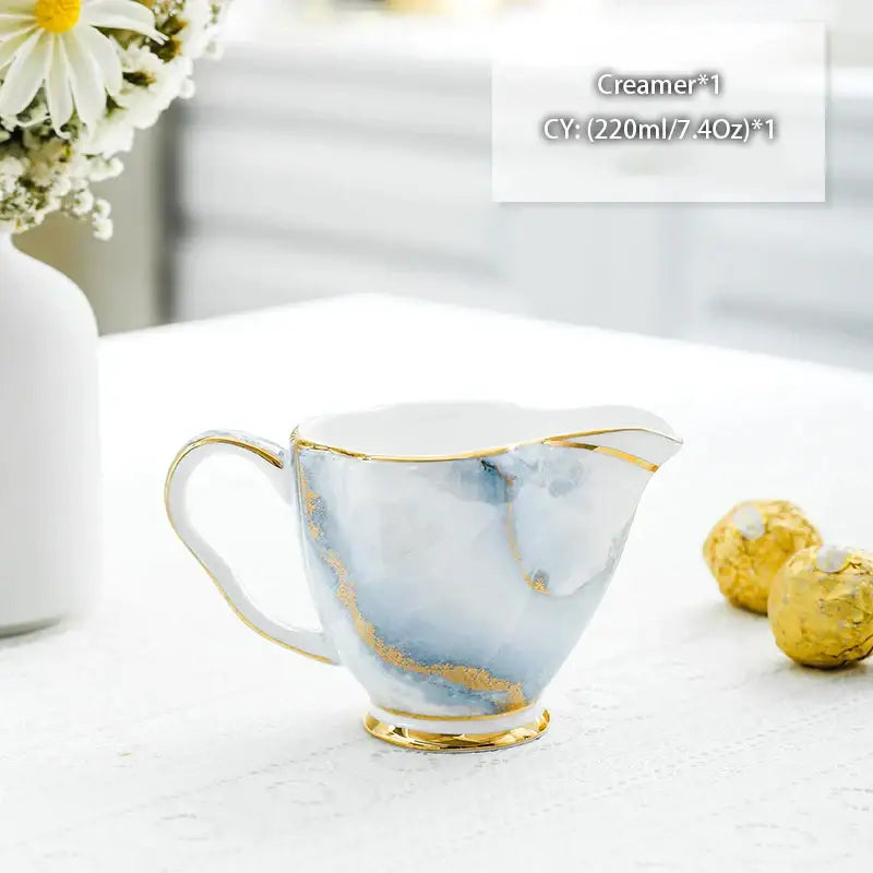 Vintage bone china milk jug with gold trim featuring blue and white marble pattern for elegant dining decorbites bone china