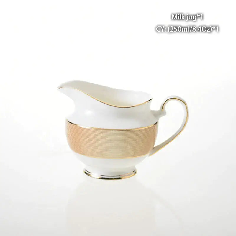 Vintage bone china milk jug with white porcelain, gold-trimmed handle, spout, and textured gold foil band decorbites bone china