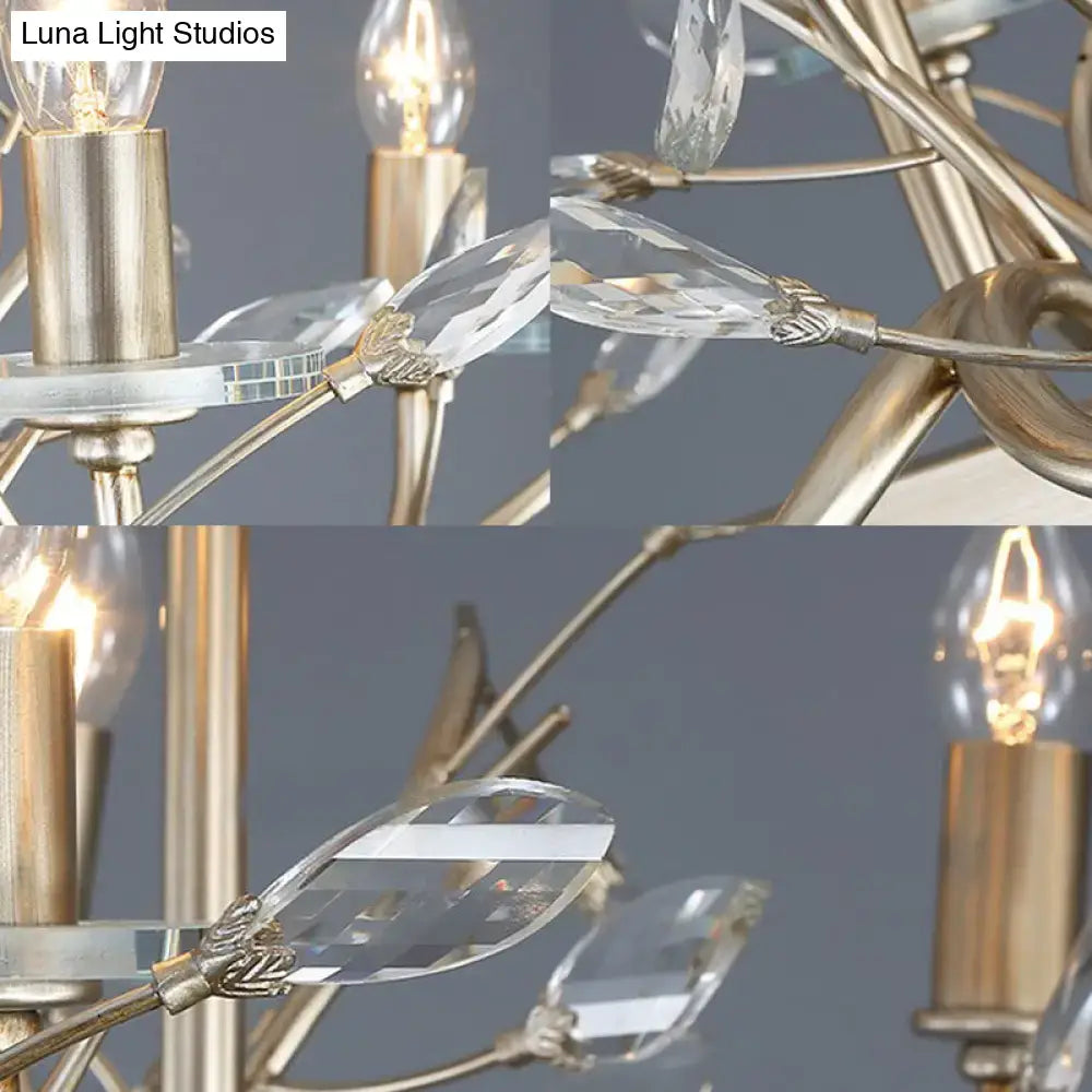 Vintage branch metal chandelier with brushed gold frame clear crystal leaf accents and exposed filament bulbs for dining room lighting