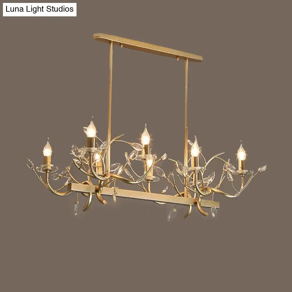 Vintage branch metal dining room chandelier in gold with intricate leaf designs and clear crystal accents