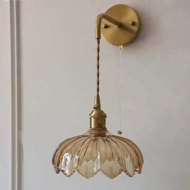 Vintage brass wall sconce with amber coffee glass petal-shaped shade and twisted cord for bedroom led light