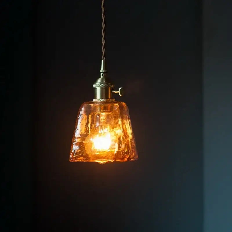 Vintage brass amber glass pendant light featuring warm textured amber glass with brass finish and twisted cord for kitchen island decorbites brass amber