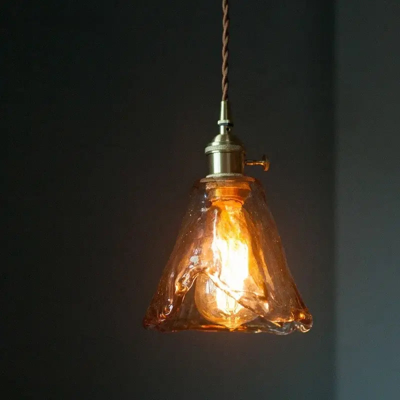 Vintage brass amber glass pendant light with warm amber glass, brass-finished metal, and twisted brown cord for kitchen island decorbites brass amber