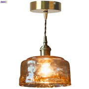 Vintage brass amber glass pendant light featuring warm amber textured glass and brass amber glass fixture for kitchen island decorbites pendant light