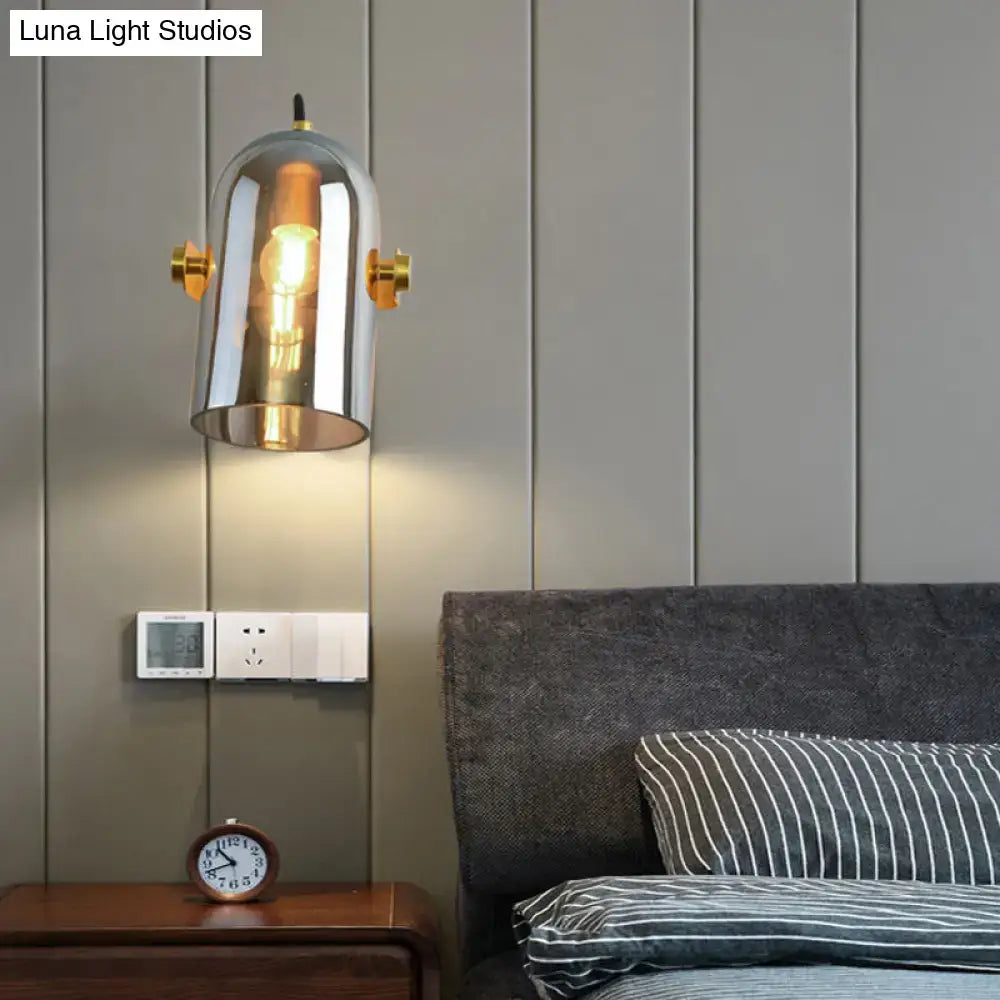 Vintage brass amber and smoke glass cloche bedside sconce with chrome-finished swivel shade cloche and incandescent bulb