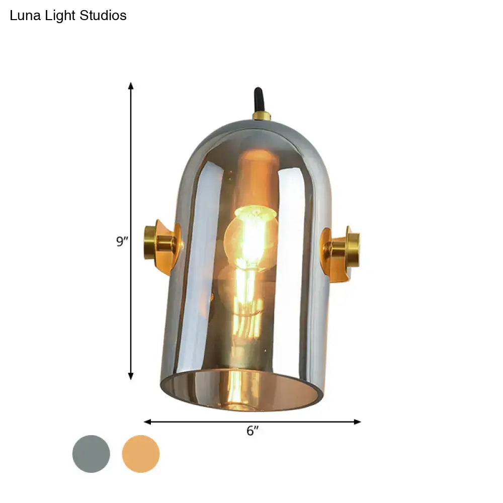 A sleek vintage brass amber swivel shade cloche bedside sconce with metallic dome and gold-toned accents for bedroom