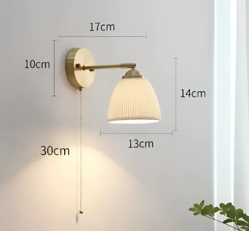 Brass-finished led wall lamp with cream pleated glass shade and pull chain for vintage bedroom sconce lighting