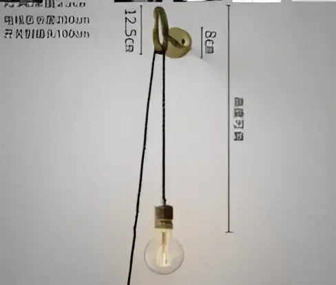 Vintage brass and amber glass led wall lamp featuring a clear glass bulb and black cord for bedroom sconce lighting