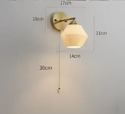 Vintage brass and amber glass led wall lamp featuring a frosted glass shade for bedroom sconce lighting