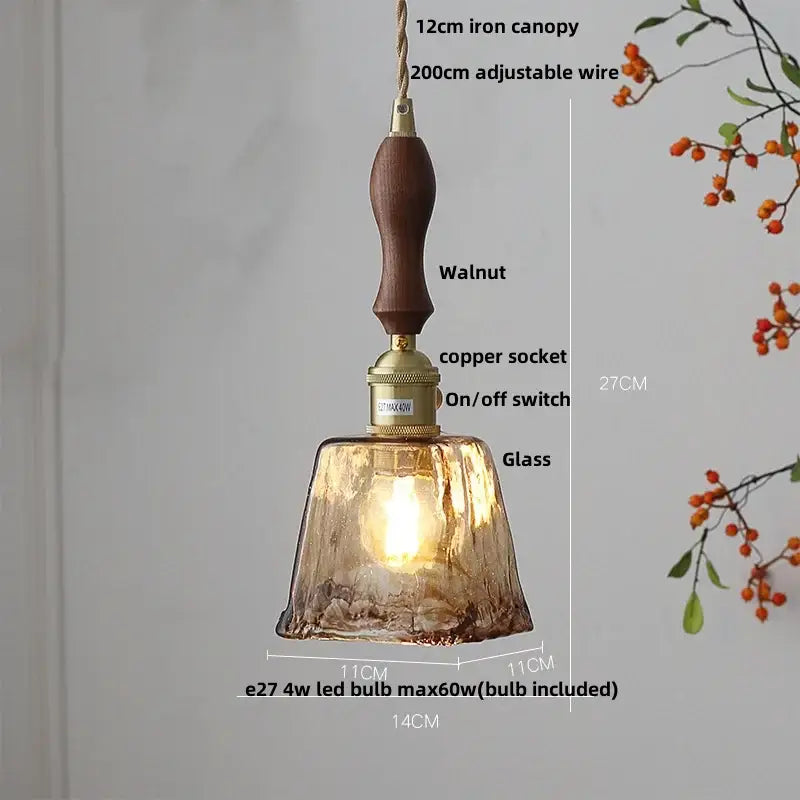 Vintage brass and amber glass pendant light featuring a warm-toned decorbites amber glass with walnut handle