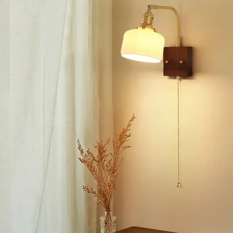 Vintage brass and amber glass wall sconce with cream ceramic led shade and wooden mounting plate for bedroom decorbites ceramic led wall