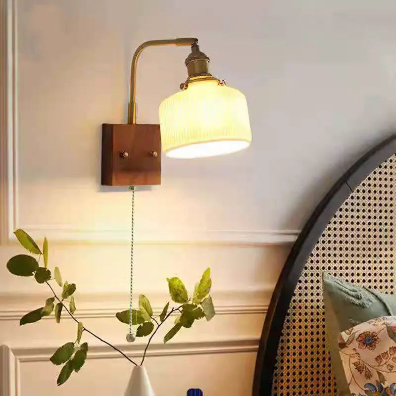 Vintage brass wall sconce with ribbed off-white glass shade and wooden mount for decorbites ceramic led wall decor