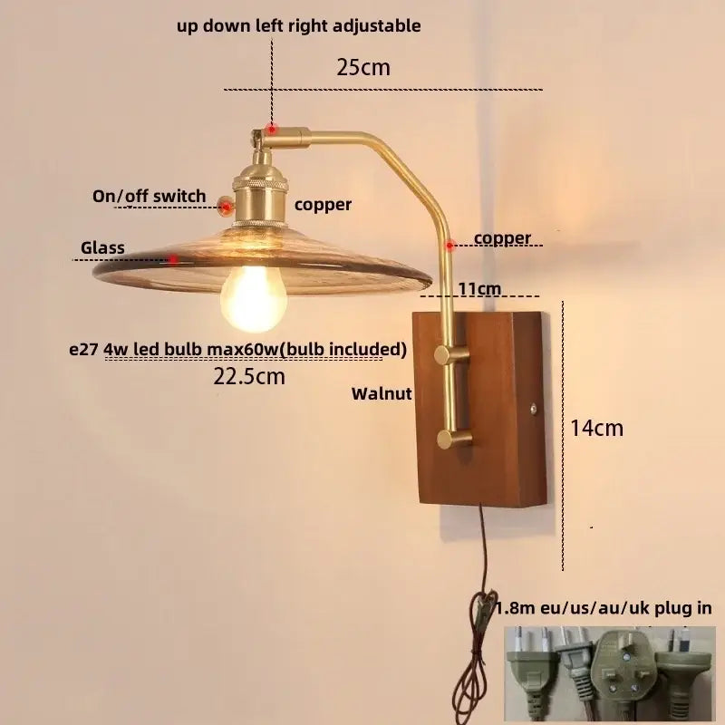 Copper-finished adjustable wall sconce with glass shade, walnut mounting plate, and vintage brass pull chain switch