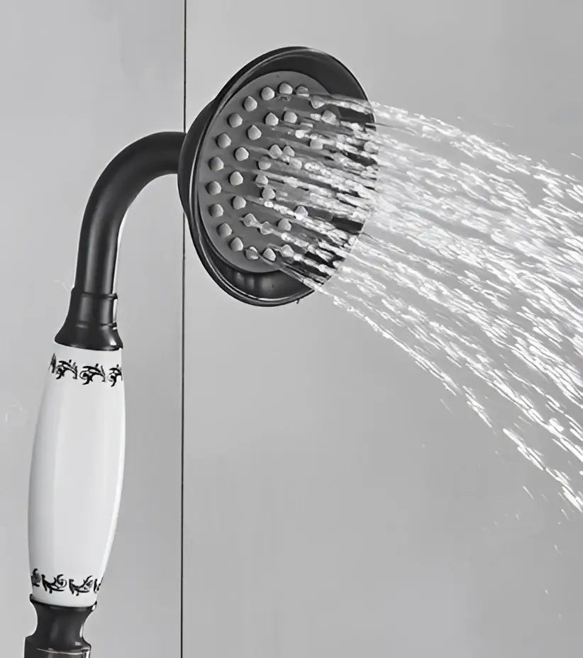 Black and white ceramic hand shower head faucet set with ornate detailing for vintage brass and bronze bathroom use