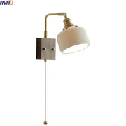 Vintage brass and ceramic led wall lights with ribbed off-white ceramic shade and wooden base for bedroom use