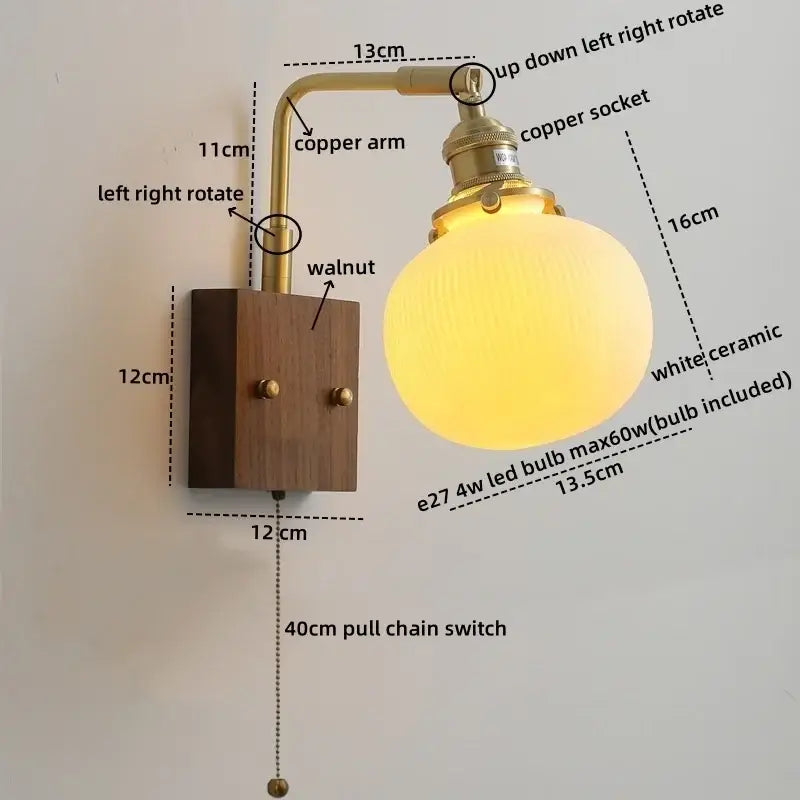 A warm-glowing white ceramic led wall light with brass copper arm and walnut base vintage bedroom sconce