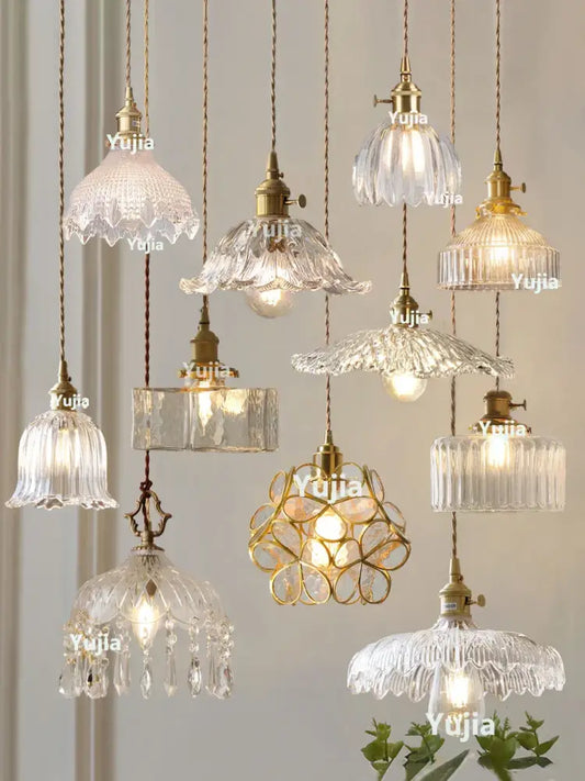 Antique brass finished pendant light with clear glass floral and geometric textured shades for kitchen use