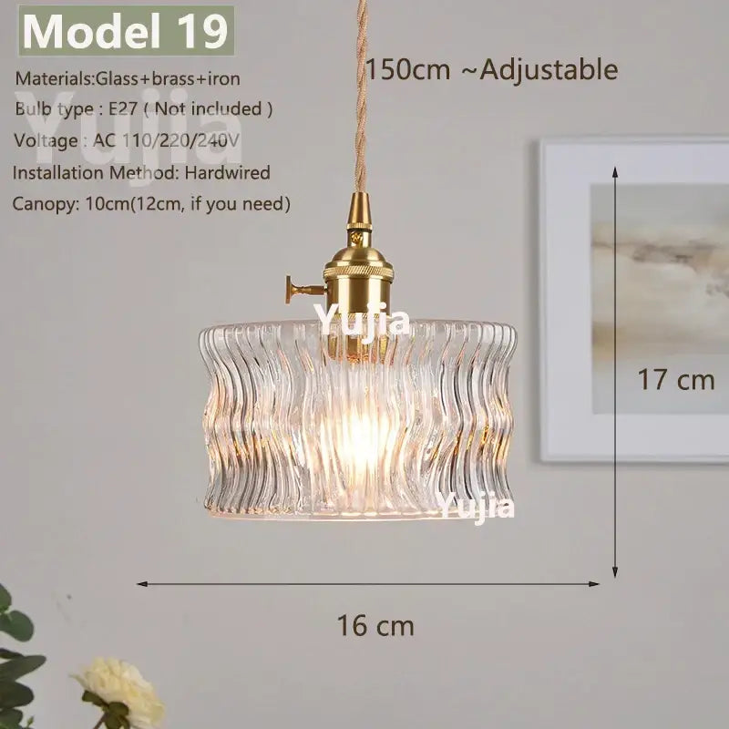 Vintage brass pendant light with clear wavy glass shade and polished copper fixture for kitchen use