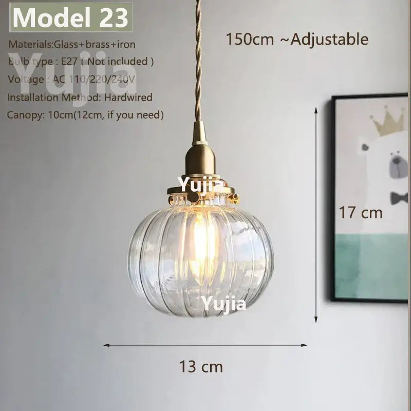 Vintage brass and clear glass pendant light with ribbed shade and adjustable twisted cord for kitchen use