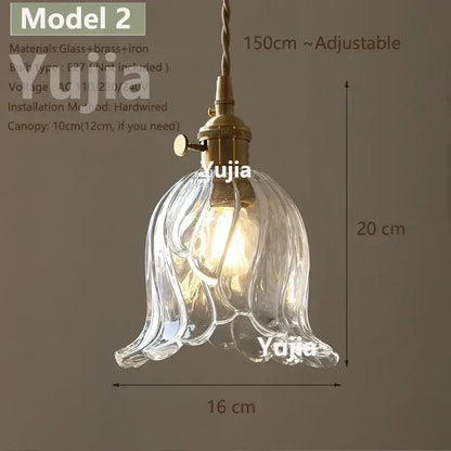Vintage brass and clear glass pendant light with polished copper floral shade designed for kitchen use