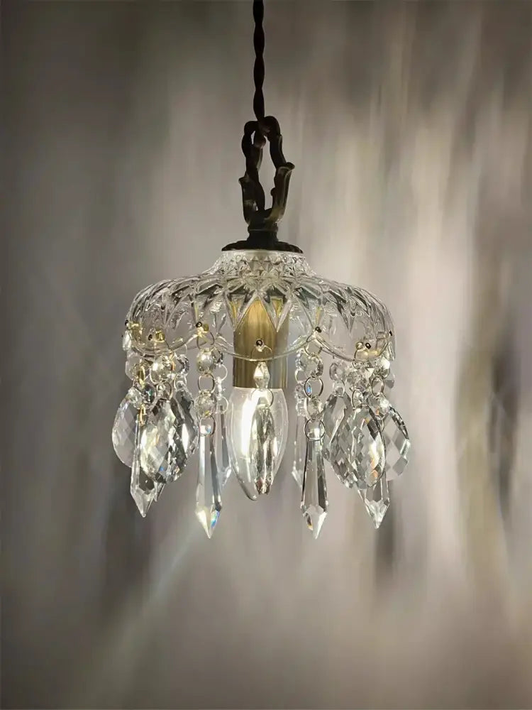 Vintage brass and clear glass pendant light with clear crystal chandelier and faceted teardrop crystals and polished copper frame