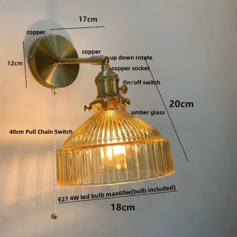 Vintage brass wall lamp with ribbed amber clear glass shade and pull chain switch for bedroom lighting