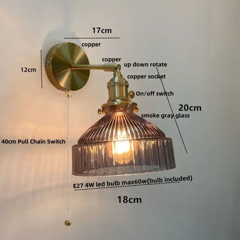 Vintage brass wall lamp with pull chain switch and ribbed smoke gray glass shade for bedroom lighting