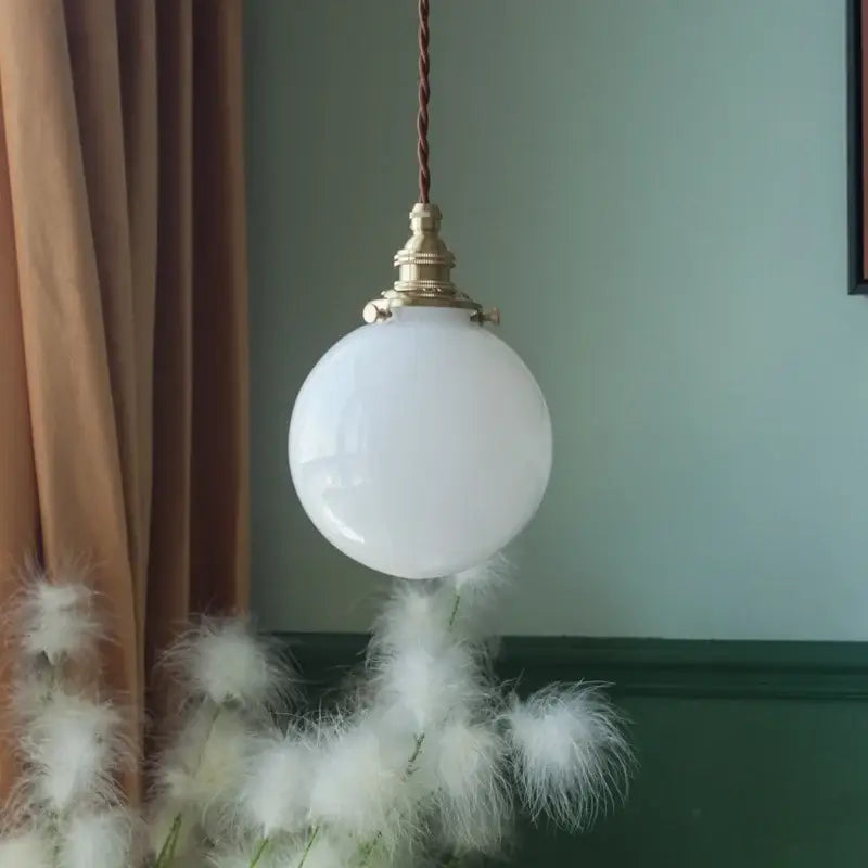 Vintage brass and cream glass ball pendant light with white spherical glass and twisted brown cord for kitchen decorbites cream glass