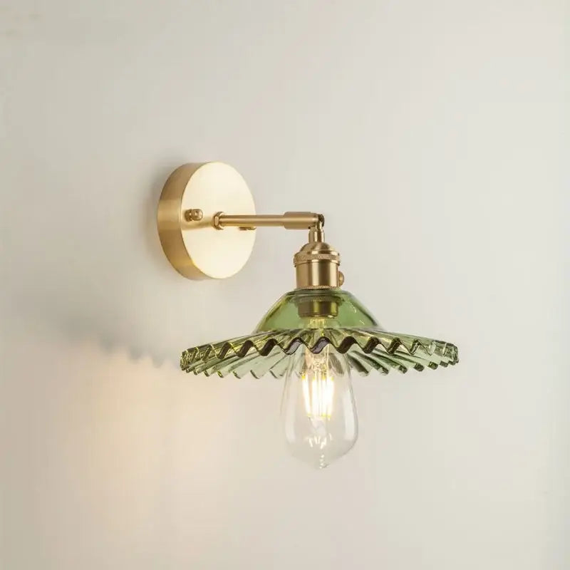 Vintage brass and green glass led wall light with scalloped design for elegant bedroom sconce lighting