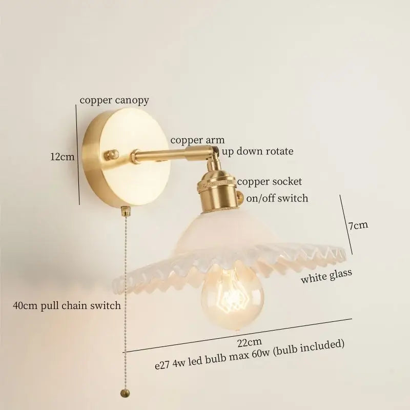 Vintage brass wall light with a copper canopy and ornate white glass shade in a green glass led bedroom sconce design